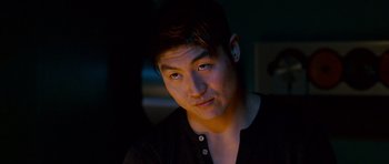 Movie still from “The Fast and the Furious: Tokyo Drift” (2006), directed by Justin Lin – A young man is looking into the camera; Close Up shot, Over the shoulder angle