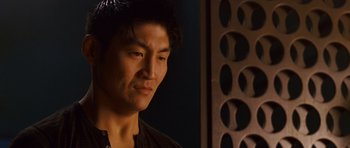 Movie still from “The Fast and the Furious: Tokyo Drift” (2006), directed by Justin Lin – A person wearing a black shirt; Close Up shot, Low angle