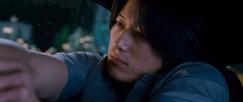 Movie still from “The Fast and the Furious: Tokyo Drift” (2006), directed by Justin Lin – A man sitting in a car looking out the window; Close Up shot, High angle