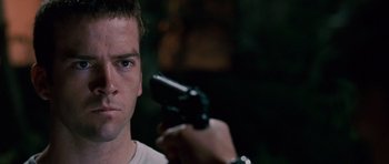 Movie still from “The Fast and the Furious: Tokyo Drift” (2006), directed by Justin Lin – A person holding a gun; Close Up shot, Over the shoulder angle