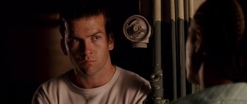 Movie still from “The Fast and the Furious: Tokyo Drift” (2006), directed by Justin Lin – A person in a white shirt; Close Up shot, Low angle