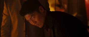 Movie still from “The Fast and the Furious: Tokyo Drift” (2006), directed by Justin Lin – A man in a black shirt is looking at the camera; Close Up shot, Low angle