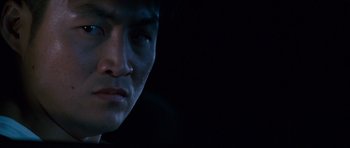 Movie still from “The Fast and the Furious: Tokyo Drift” (2006), directed by Justin Lin – A man's face in the dark; Close Up shot, Low angle
