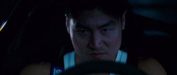 Movie still from “The Fast and the Furious: Tokyo Drift” (2006), directed by Justin Lin – A person looking at the camera; Close Up shot, Low angle