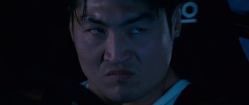 Movie still from “The Fast and the Furious: Tokyo Drift” (2006), directed by Justin Lin – A man's face in the dark; Close Up shot, Low angle
