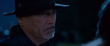 Movie still from “The Fast and the Furious: Tokyo Drift” (2006), directed by Justin Lin – A person wearing a hat; Close Up shot, Over the shoulder angle