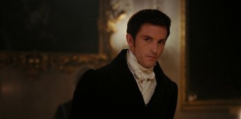 Movie still from “Bridgerton” (2020), created by Chris Van Dusen – A man wearing a black coat and a white neck tie; Close Up shot, Over the shoulder angle