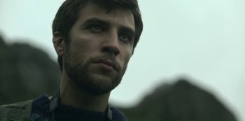 Movie still from “The Girl in the Mirror” (2022), created by Sergio G. Sánchez – A person with a beard; Close Up shot, Low angle