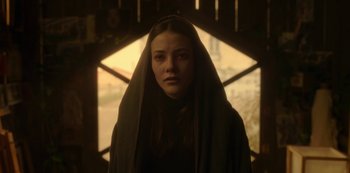 Movie still from “The Girl in the Mirror” (2022), created by Sergio G. Sánchez – A woman with a long veil standing in front of a window; Close Up shot, Low angle