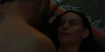 Movie still from “The Girl in the Mirror” (2022), created by Sergio G. Sánchez – A man and a woman looking at each other in a mirror; Close Up shot, Overhead angle