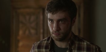 Movie still from “The Girl in the Mirror” (2022), created by Sergio G. Sánchez – A person wearing a shirt; Close Up shot, Over the shoulder angle