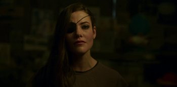 Movie still from “The Girl in the Mirror” (2022), created by Sergio G. Sánchez – A woman with a pirate eye patch on; Close Up shot, Over the shoulder angle
