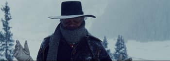 Movie still from “The Hateful Eight” (2015), directed by Quentin Tarantino – A man with a hat and a scarf around his neck; Close Up shot, Low angle
