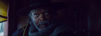 Movie still from “The Hateful Eight” (2015), directed by Quentin Tarantino – A person wearing a hat and a scarf; Close Up shot, Low angle