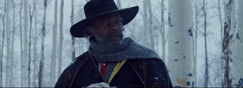 Movie still from “The Hateful Eight” (2015), directed by Quentin Tarantino – An older man wearing a hat and a scarf; Close Up shot, Low angle