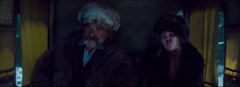 Movie still from “The Hateful Eight” (2015), directed by Quentin Tarantino – A man with a beard and a fur hat; Medium shot, Low angle