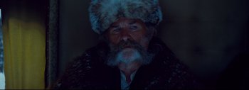 Movie still from “The Hateful Eight” (2015), directed by Quentin Tarantino – An old man with a beard and a fur hat; Close Up shot, Low angle