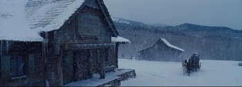 Movie still from “The Hateful Eight” (2015), directed by Quentin Tarantino – A snow storm is coming down in the mountains; Extreme Wide shot, High angle