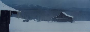 Movie still from “The Hateful Eight” (2015), directed by Quentin Tarantino – A barn in the middle of a snow covered field; Extreme Wide shot, High angle
