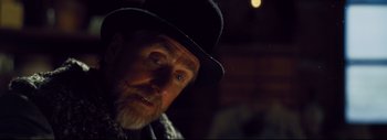 Movie still from “The Hateful Eight” (2015), directed by Quentin Tarantino – A person wearing a hat; Close Up shot, Over the shoulder angle