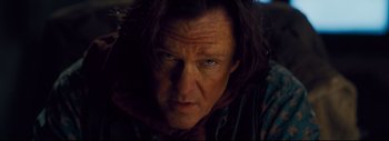 Movie still from “The Hateful Eight” (2015), directed by Quentin Tarantino – A person with long black hair; Close Up shot, Low angle
