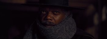 Movie still from “The Hateful Eight” (2015), directed by Quentin Tarantino – A man wearing a hat and a scarf; Close Up shot, Low angle
