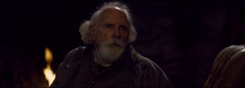 Movie still from “The Hateful Eight” (2015), directed by Quentin Tarantino – An old man with a white beard wearing a military uniform; Close Up shot, Over the shoulder angle