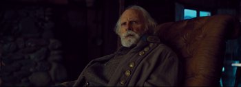 Movie still from “The Hateful Eight” (2015), directed by Quentin Tarantino – An old man with a white beard wearing a military uniform; Close Up shot, Over the shoulder angle