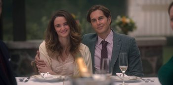 Movie still from “The Haunting of Bly Manor” (2020), directed by E.L. Katz – A man and a woman sitting at a dinner table; Medium shot, Over the shoulder angle