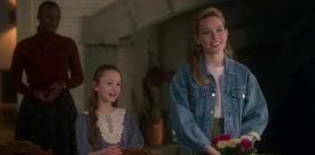 Movie still from “The Haunting of Bly Manor” (2020), directed by E.L. Katz – Two young girls standing next to each other in a room; Medium shot, Over the shoulder angle