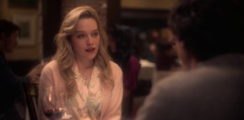 Movie still from “The Haunting of Bly Manor” (2020), directed by E.L. Katz – A woman sitting at a table with a glass of wine; Close Up shot, Over the shoulder angle