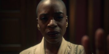 Movie still from “The Haunting of Bly Manor” (2020), directed by E.L. Katz – A person with a bald head; Close Up shot, Over the shoulder angle