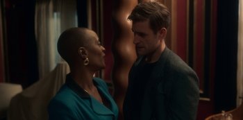 Movie still from “The Haunting of Bly Manor” (2020), directed by E.L. Katz – A man and a woman standing next to each other; Medium shot, Over the shoulder angle