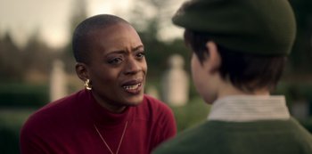 Movie still from “The Haunting of Bly Manor” (2020), directed by E.L. Katz – A woman talking to another woman in a red shirt; Close Up shot, Over the shoulder angle