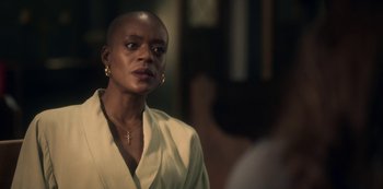 Movie still from “The Haunting of Bly Manor” (2020), directed by E.L. Katz – A woman in a white shirt is looking at the camera; Close Up shot, Over the shoulder angle