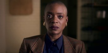 Movie still from “The Haunting of Bly Manor” (2020), directed by E.L. Katz – A woman in a jacket and a blue shirt; Close Up shot, High angle