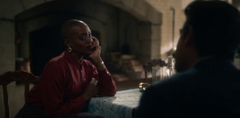 Movie still from “The Haunting of Bly Manor” (2020), directed by E.L. Katz – A woman sitting at a table with a glass of water; Close Up shot, Over the shoulder angle