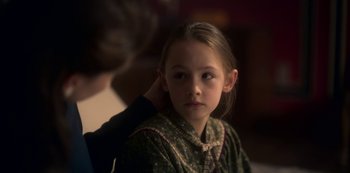 Movie still from “The Haunting of Bly Manor” (2020), directed by E.L. Katz – A young girl getting her hair cut by a stylist; Close Up shot, Over the shoulder angle