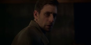 Movie still from “The Haunting of Bly Manor” (2020), directed by E.L. Katz – A person wearing a brown jacket; Close Up shot, Over the shoulder angle