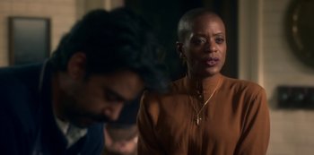 Movie still from “The Haunting of Bly Manor” (2020), directed by E.L. Katz – A woman in a brown shirt and a man in a black shirt; Close Up shot, Over the shoulder angle