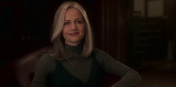 Movie still from “The Haunting of Bly Manor” (2020), directed by E.L. Katz – A woman with blonde hair sitting in a chair; Close Up shot, Over the shoulder angle