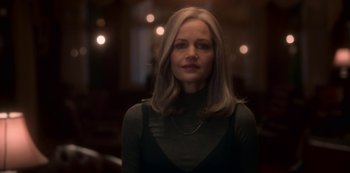 Movie still from “The Haunting of Bly Manor” (2020), directed by E.L. Katz – A woman with long blonde hair wearing a black top; Close Up shot, Low angle