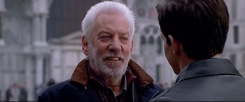 Movie still from “The Italian Job” (2003), directed by F. Gary Gray – An older man with white hair talking to a younger man; Close Up shot, Over the shoulder angle