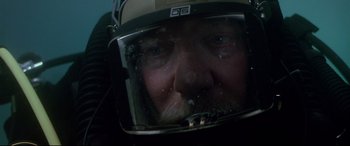 Movie still from “The Italian Job” (2003), directed by F. Gary Gray – A person wearing a helmet; Close Up shot, Overhead angle