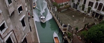 Movie still from “The Italian Job” (2003), directed by F. Gary Gray – Two boats in the water on a canal; Extreme Wide shot, Overhead angle
