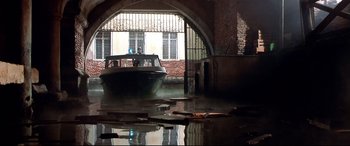 Movie still from “The Italian Job” (2003), directed by F. Gary Gray – A boat in the middle of a flooded street; Extreme Wide shot, Low angle