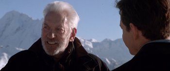 Movie still from “The Italian Job” (2003), directed by F. Gary Gray – An older man with white hair and a man with white hair; Close Up shot, Low angle