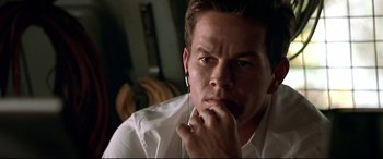 Movie still from “The Italian Job” (2003), directed by F. Gary Gray – A person wearing a white shirt; Close Up shot, Low angle