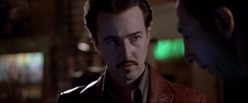 Movie still from “The Italian Job” (2003), directed by F. Gary Gray – A person with a mustache; Close Up shot, Low angle