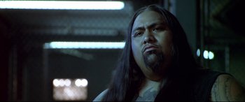 Movie still from “The Italian Job” (2003), directed by F. Gary Gray – A person with long black hair; Close Up shot, Low angle